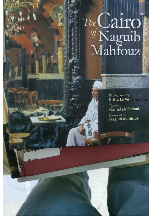 The Cairo of Naguib Mahfouz Hardcover – September 15, 2012 by Britta Le Va (Photographer), Naguib Mahfouz